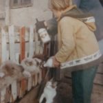 Farm girl Bottle feeding Lambs